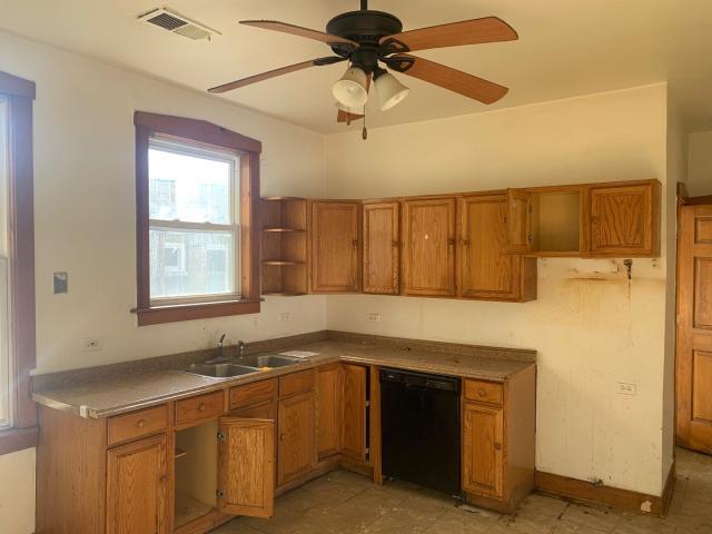 820 Elgin Avenue Forest Park, IL 60130 - Photo 15 of 20 a kitchen with a sink cabinets and window