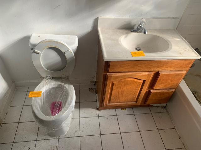 820 Elgin Avenue Forest Park, IL 60130 - Photo 16 of 20 a bathroom with a sink and mirror
