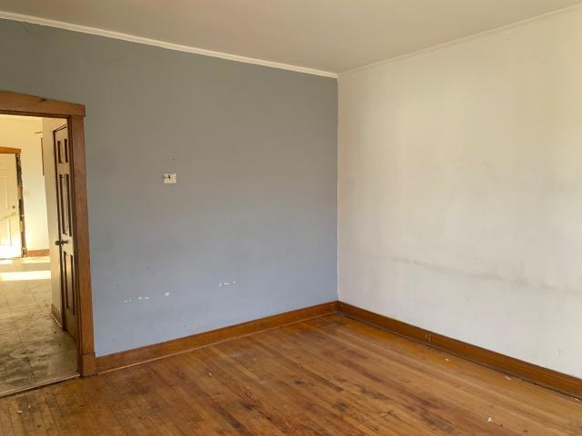 820 Elgin Avenue Forest Park, IL 60130 - Photo 17 of 20 an empty room with wooden floor and windows