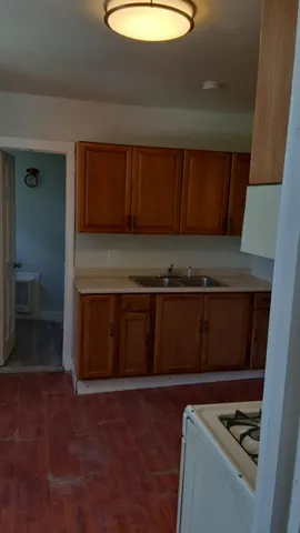 a kitchen with a cabinets and a sink
