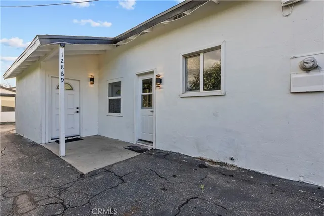 a view of a house with a snow in the yard