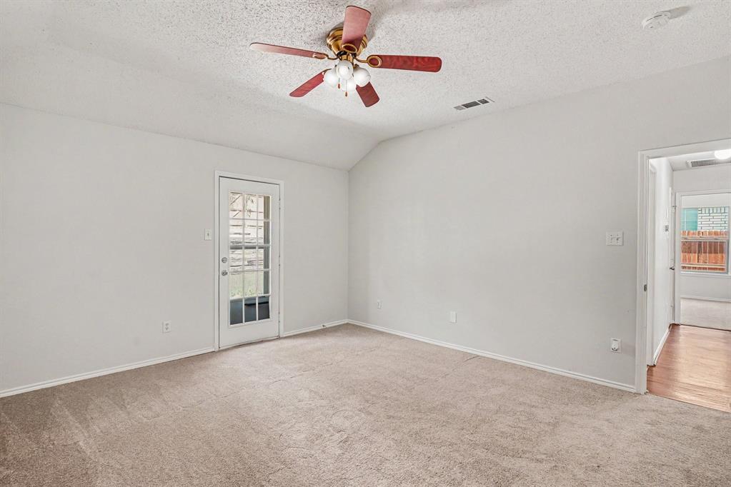 2541 Rivers Edge Drive Fort Worth, TX 76118 - Photo 13 of 31 an empty room with windows and fan
