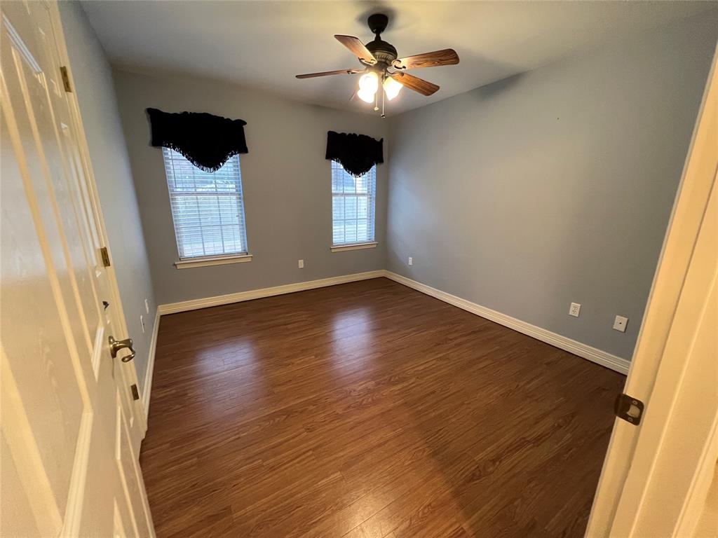 1825 Glenway Drive Sherman, TX 75092 - Photo 11 of 21 wooden floor in an empty room with a window