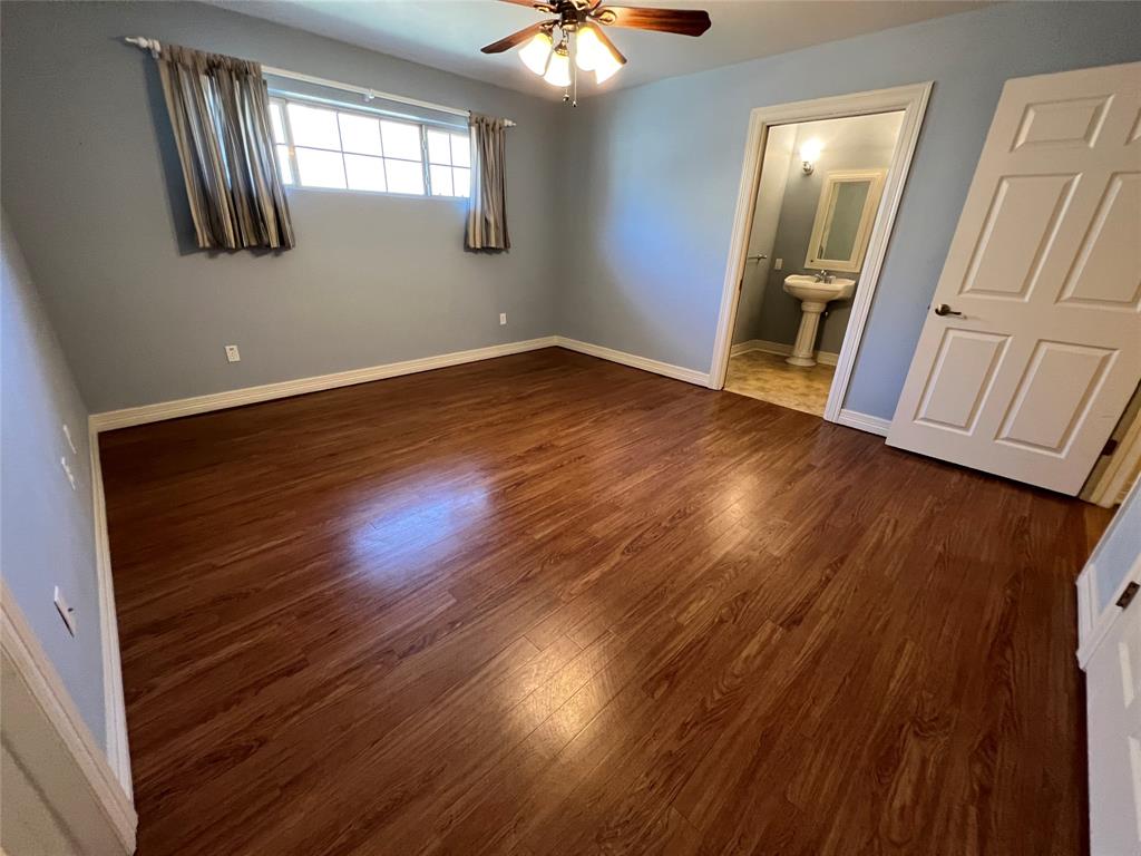 1825 Glenway Drive Sherman, TX 75092 - Photo 12 of 21 a view of an empty room with wooden floor and a window