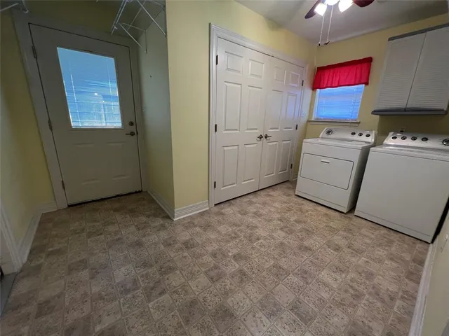 a view of storage and utility room with washer and dryer