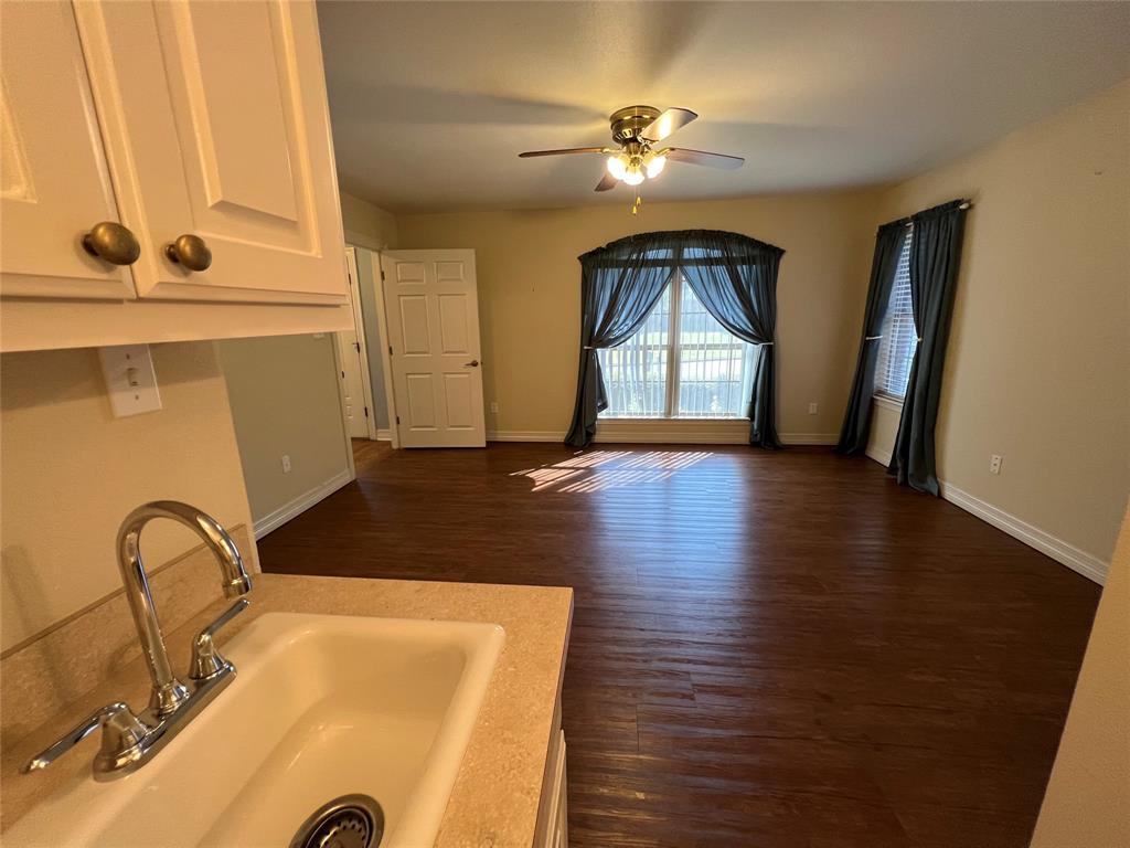 1825 Glenway Drive Sherman, TX 75092 - Photo 8 of 21 a view of an empty room with window and wooden floor