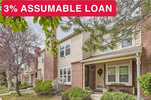 a sign that is sitting in front of a house