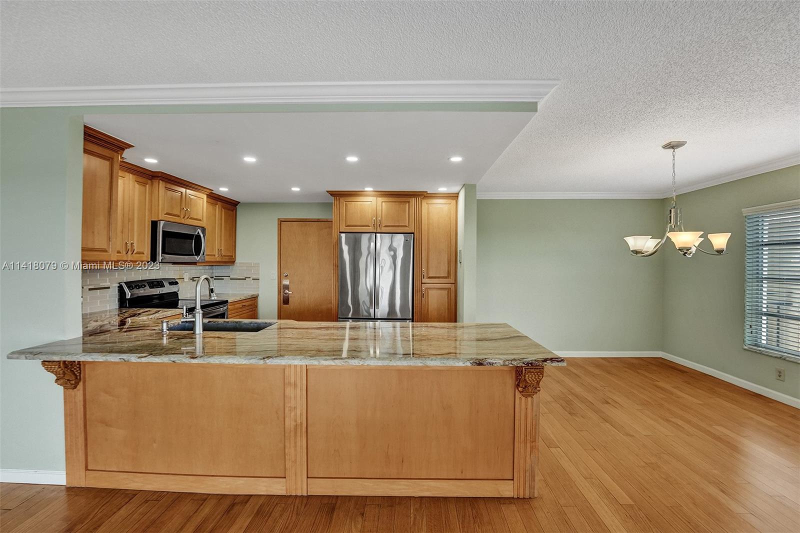 10777 West Sample Road, Unit 614 Coral Springs, FL 33065 - Photo 16 of 40 a view of kitchen with stainless steel appliances granite countertop sink and stove
