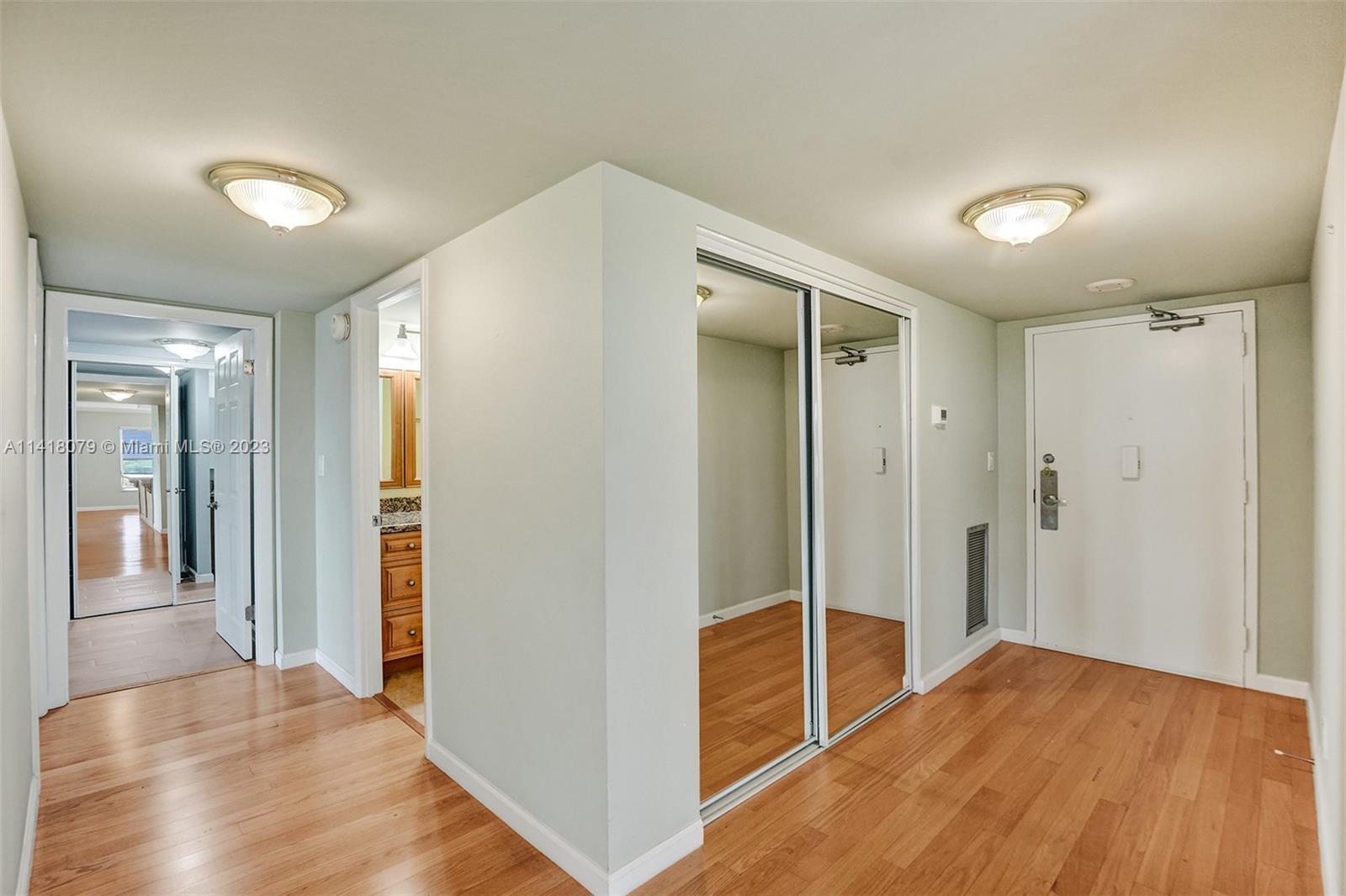 10777 West Sample Road, Unit 614 Coral Springs, FL 33065 - Photo 22 of 40 a view of a hallway with wooden floor
