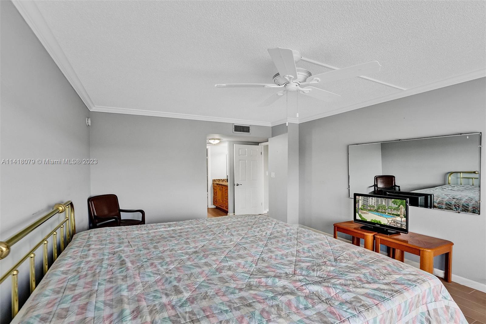 10777 West Sample Road, Unit 614 Coral Springs, FL 33065 - Photo 25 of 40 a bedroom with furniture and a bed