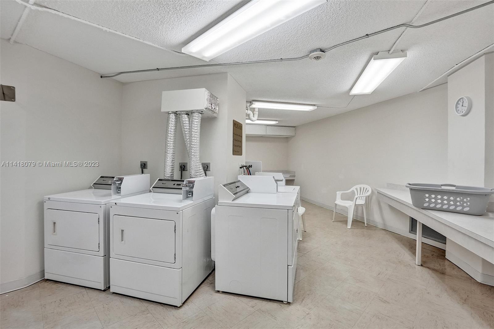 10777 West Sample Road, Unit 614 Coral Springs, FL 33065 - Photo 39 of 40 a utility room with dryer and washer