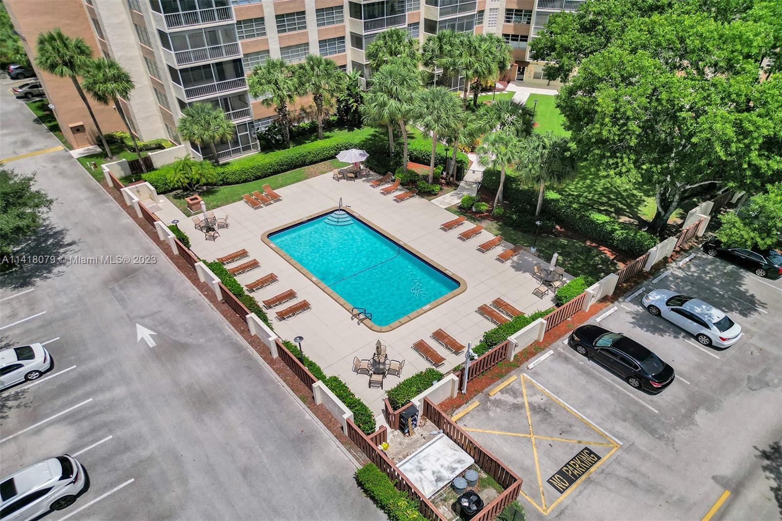 10777 West Sample Road, Unit 614 Coral Springs, FL 33065 - Photo 5 of 40 an aerial view of a house with a garden