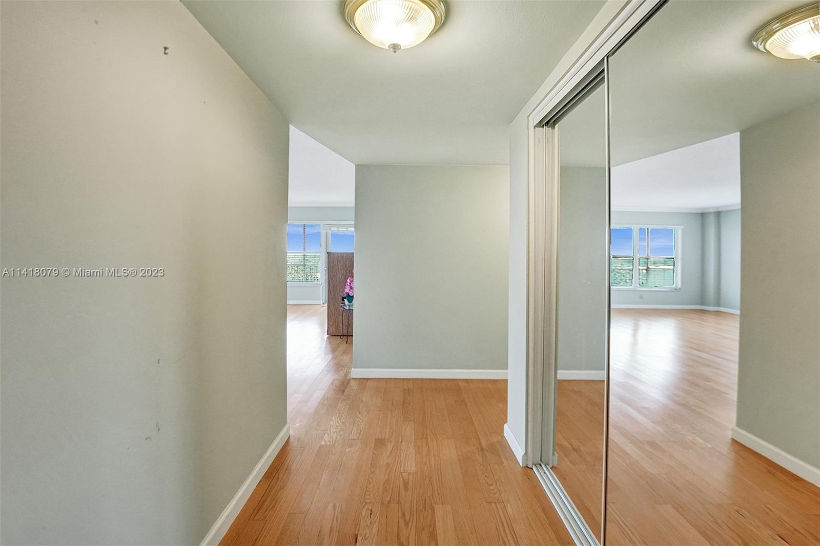 10777 West Sample Road, Unit 614 Coral Springs, FL 33065 - Photo 10 of 40 a view of a hallway with wooden floor
