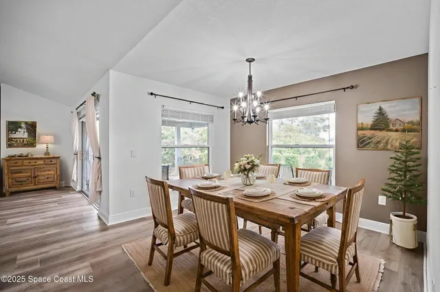 a bedroom with a bed and a flat screen television