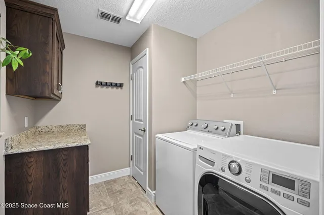 a living room with furniture and large windows