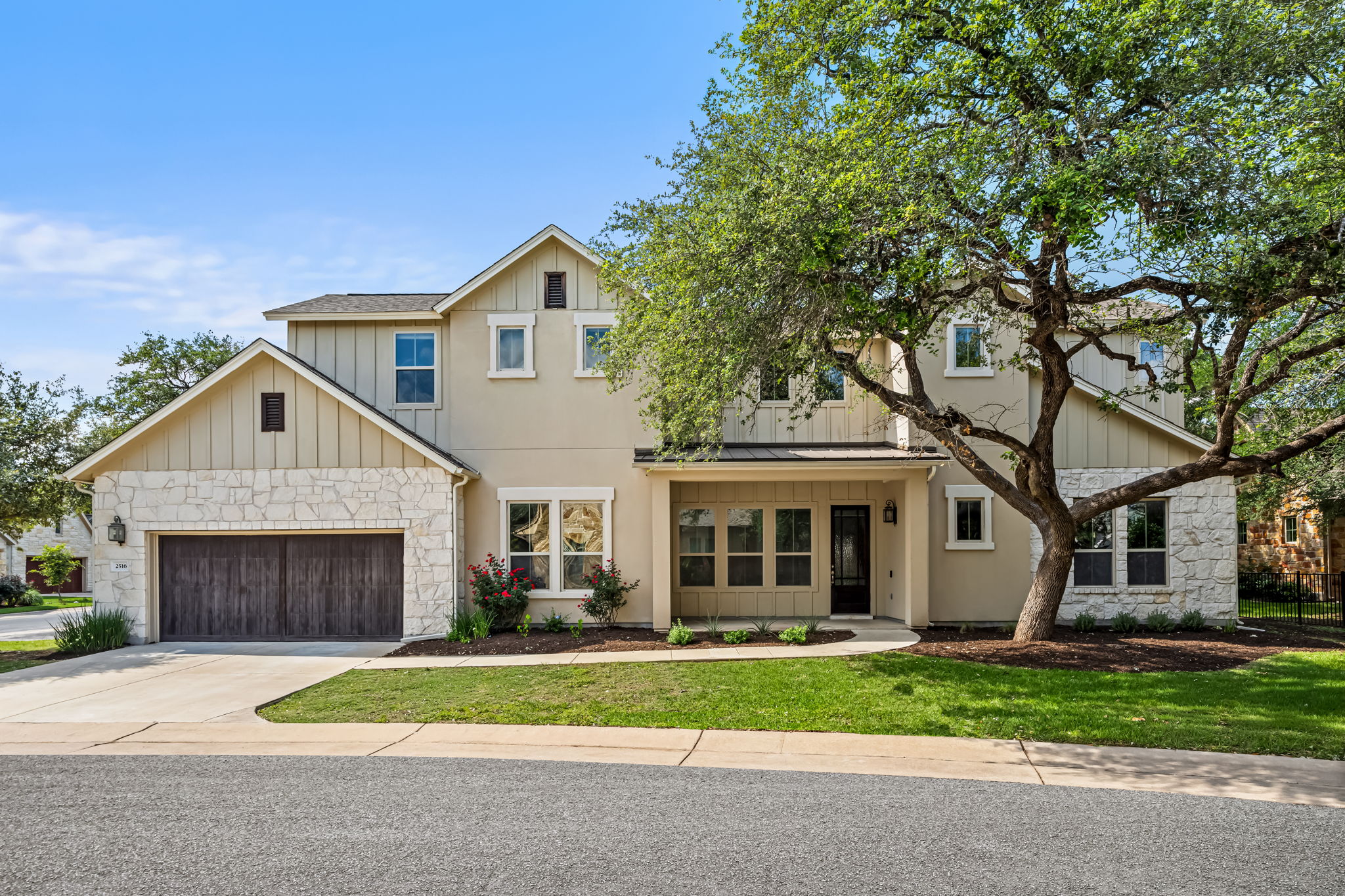 Stone and stucco exterior with board and batten accents