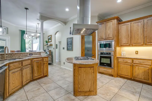 a living room with furniture a flat screen tv and a large window