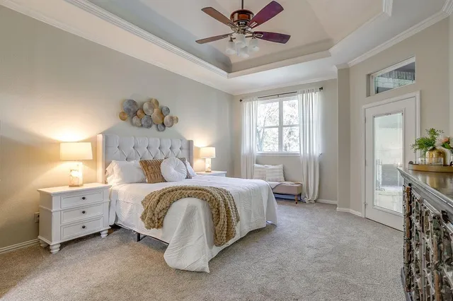 a bedroom with a bed and a television