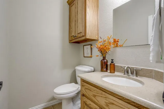 a living room with fireplace furniture and a wooden floor