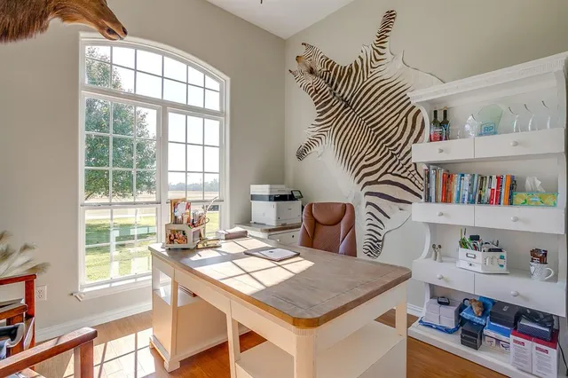 a kitchen with granite countertop stove sink and cabinets