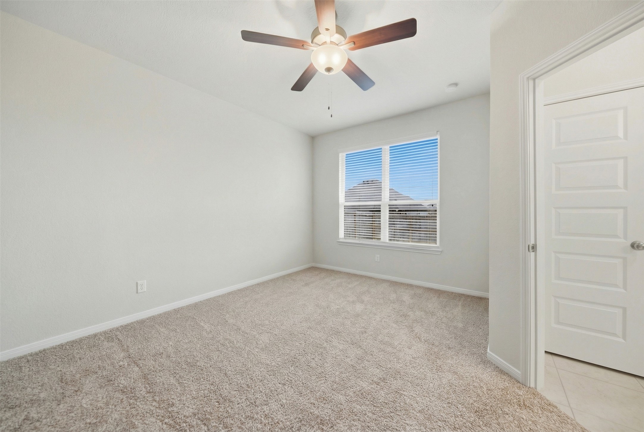 1443 Lk Rdg Drive Brenham, TX 77833 - Photo 16 of 17 an empty room with windows and fan