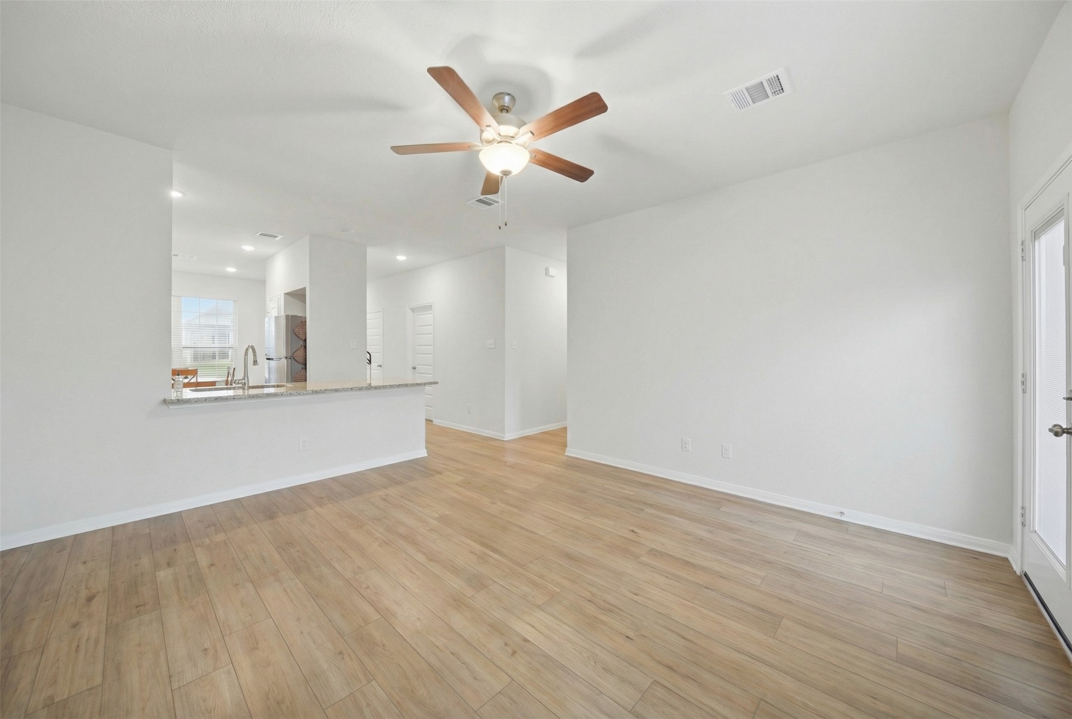 1443 Lk Rdg Drive Brenham, TX 77833 - Photo 9 of 17 a view of an empty room with cabinet and a ceiling fan