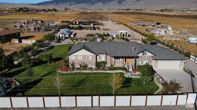 1103 North Brooklyn Road Monroe, UT 84754 - Photo 70 of 78 View of front of house with driveway, stone siding, covered porch, and a mountain view