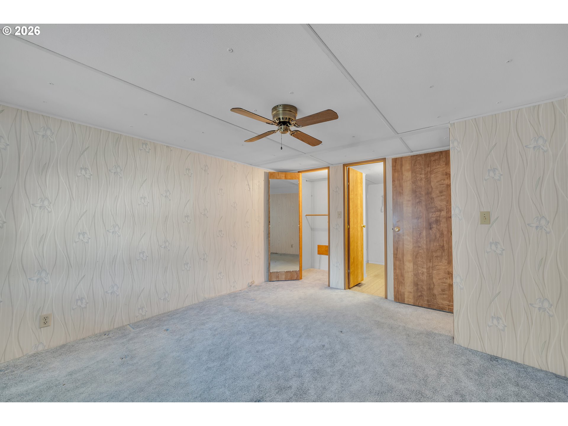 3137 Rainbow Loop Hubbard, OR 97032 - Photo 22 of 27 a view of an empty room with a ceiling fan