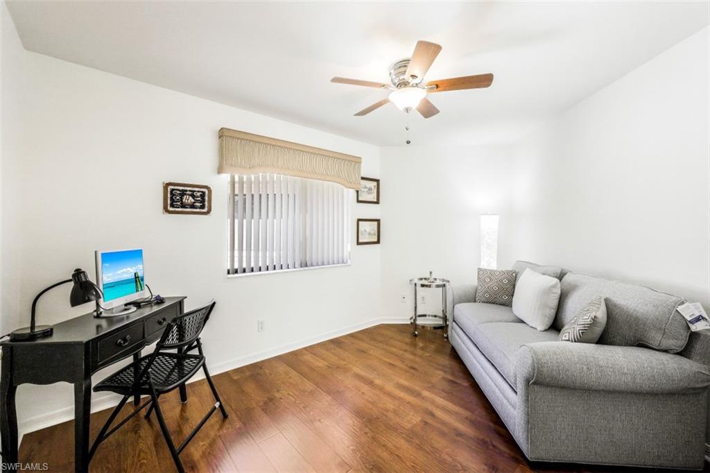78 Bennington Drive, Unit 58 Naples, FL 34104 - Photo 20 of 24 a living room with furniture and a window