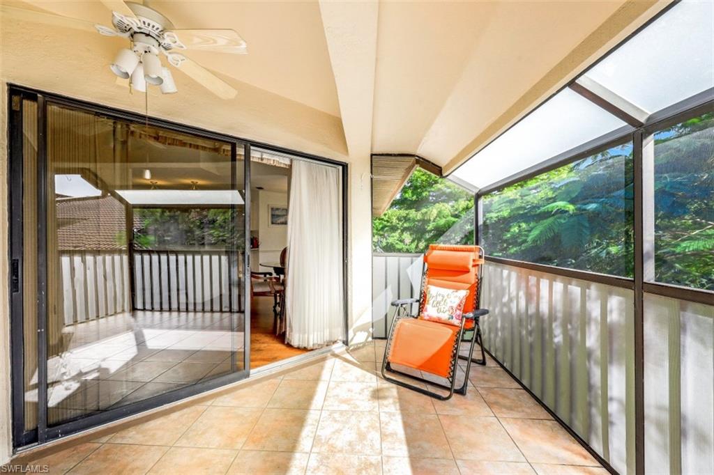 78 Bennington Drive, Unit 58 Naples, FL 34104 - Photo 23 of 24 a balcony view with a garden