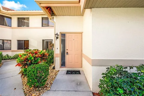 a view of a entryway with flower plants