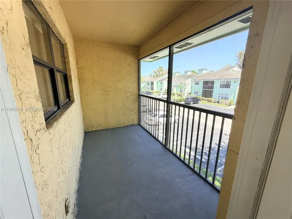 a view of a glass door with a porch