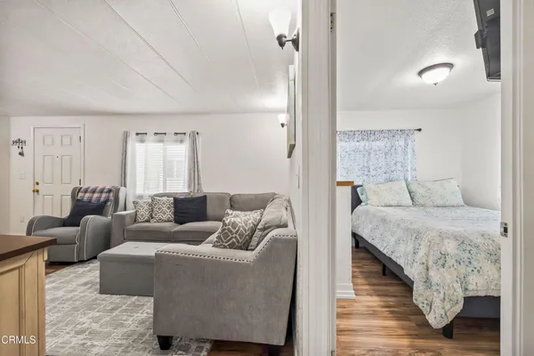 a bedroom with a bed and a table in it