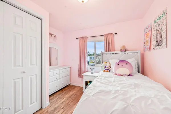 a bathroom with a granite countertop toilet sink and mirror