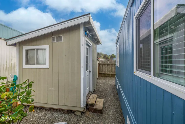 a storage room with lots of clutter and cabinets