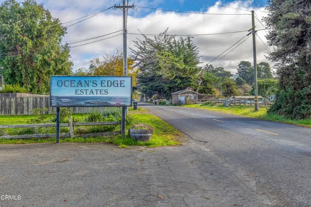 a view of outdoor space with signage and flags