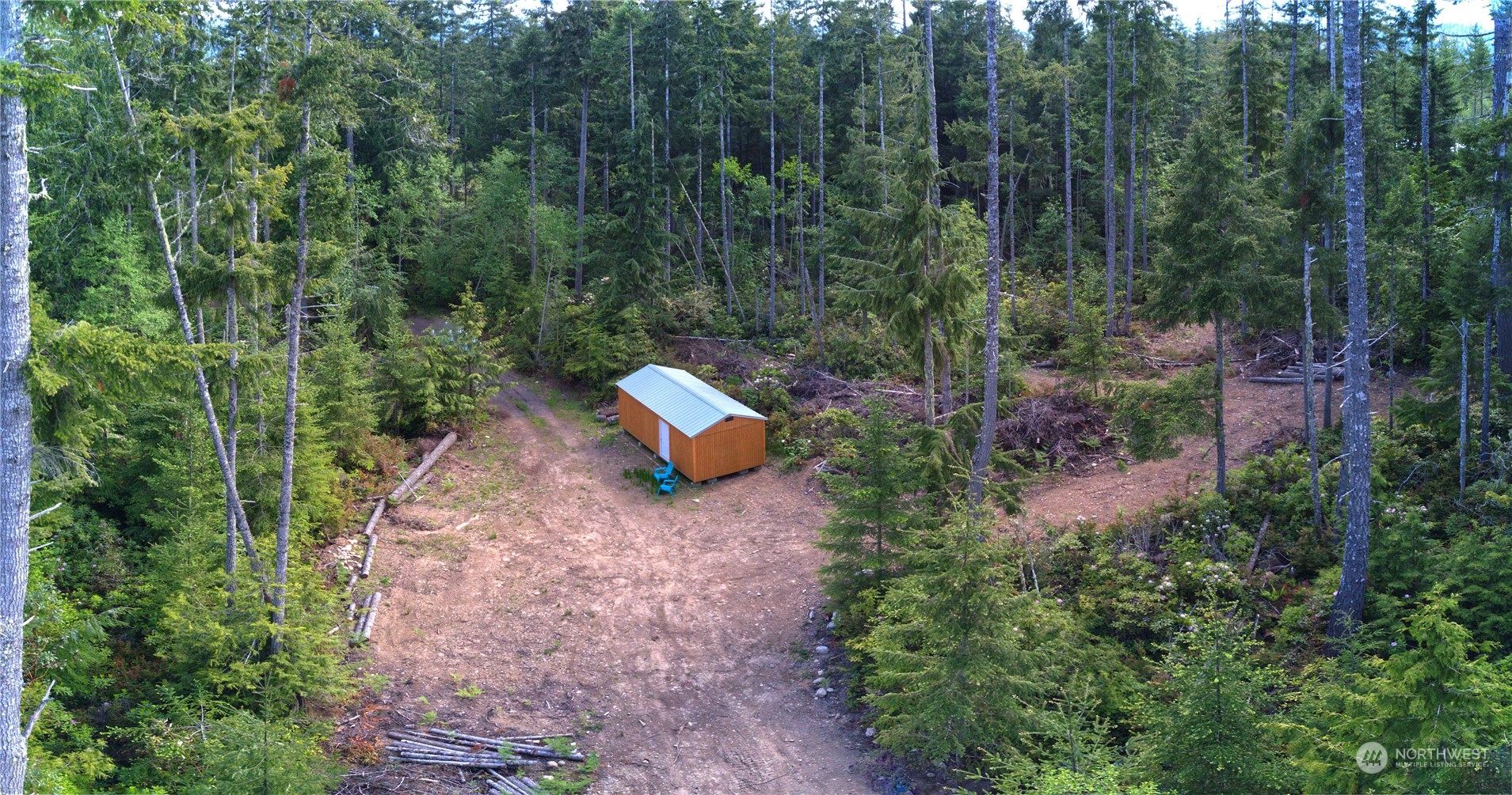 376 Whitney Road Quilcene, WA 98376 - Photo 11 of 31 a backyard of a house with a yard and outdoor seating