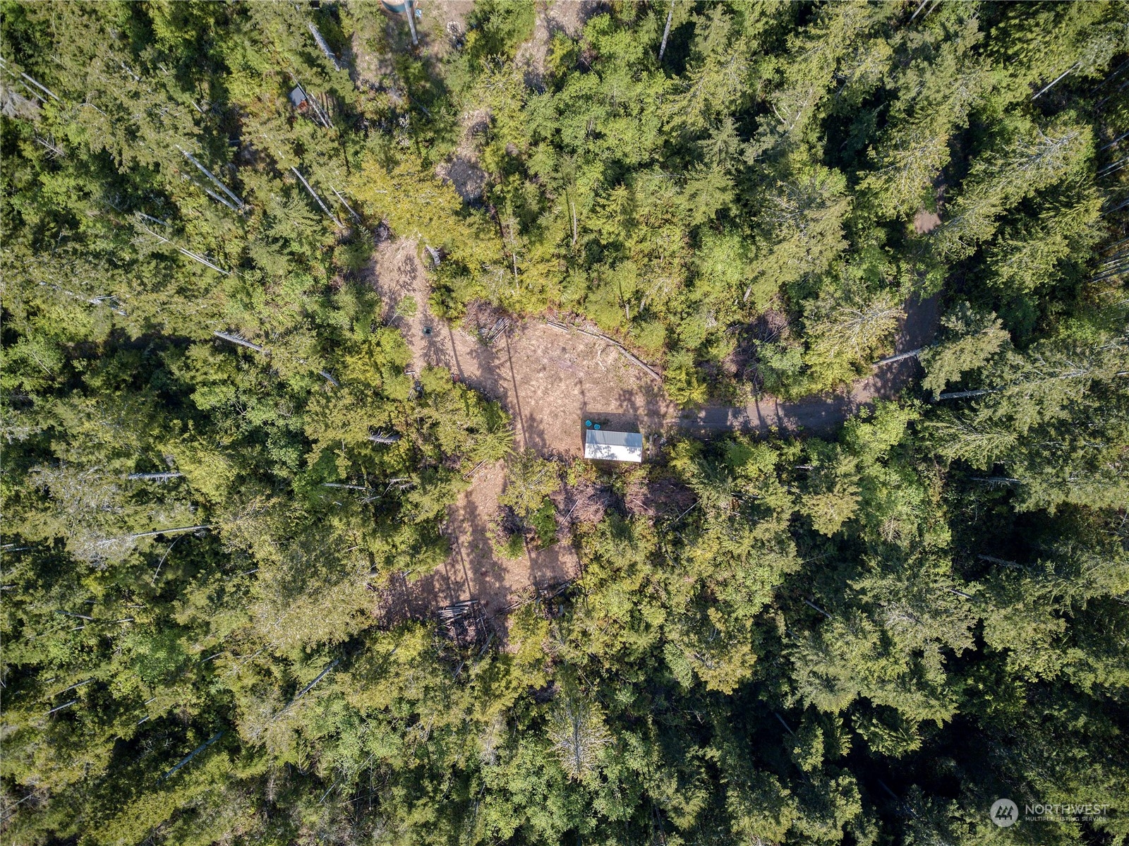 376 Whitney Road Quilcene, WA 98376 - Photo 19 of 31 a view of a house with a tree