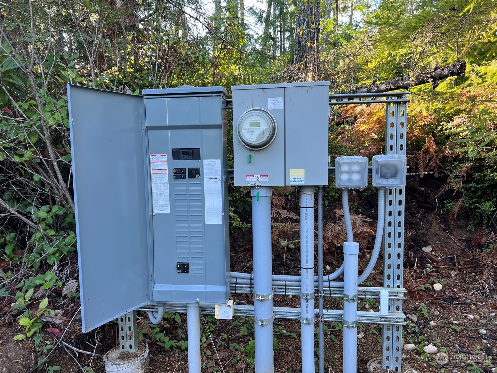 376 Whitney Road Quilcene, WA 98376 - Photo 31 of 31 a view of a brick wall with plants in front of it