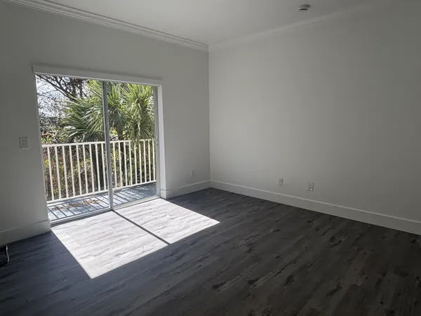 a view of wooden floor and windows
