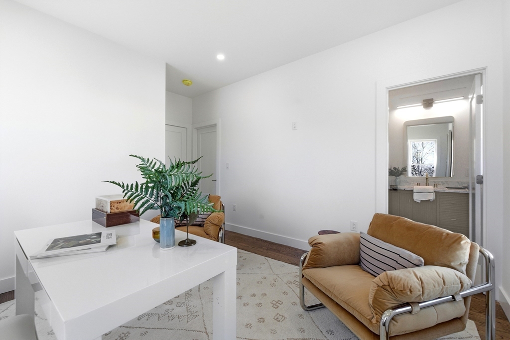 51 Fox Hill Road Nahant, MA 01908 - Photo 20 of 36 a living room with furniture and a potted plant