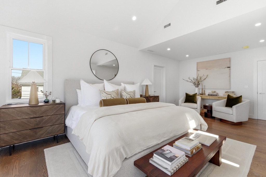 51 Fox Hill Road Nahant, MA 01908 - Photo 25 of 36 a bedroom with bed and a chandelier