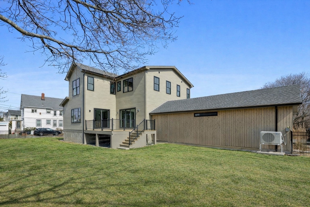 51 Fox Hill Road Nahant, MA 01908 - Photo 3 of 36 a front view of a house with a garden