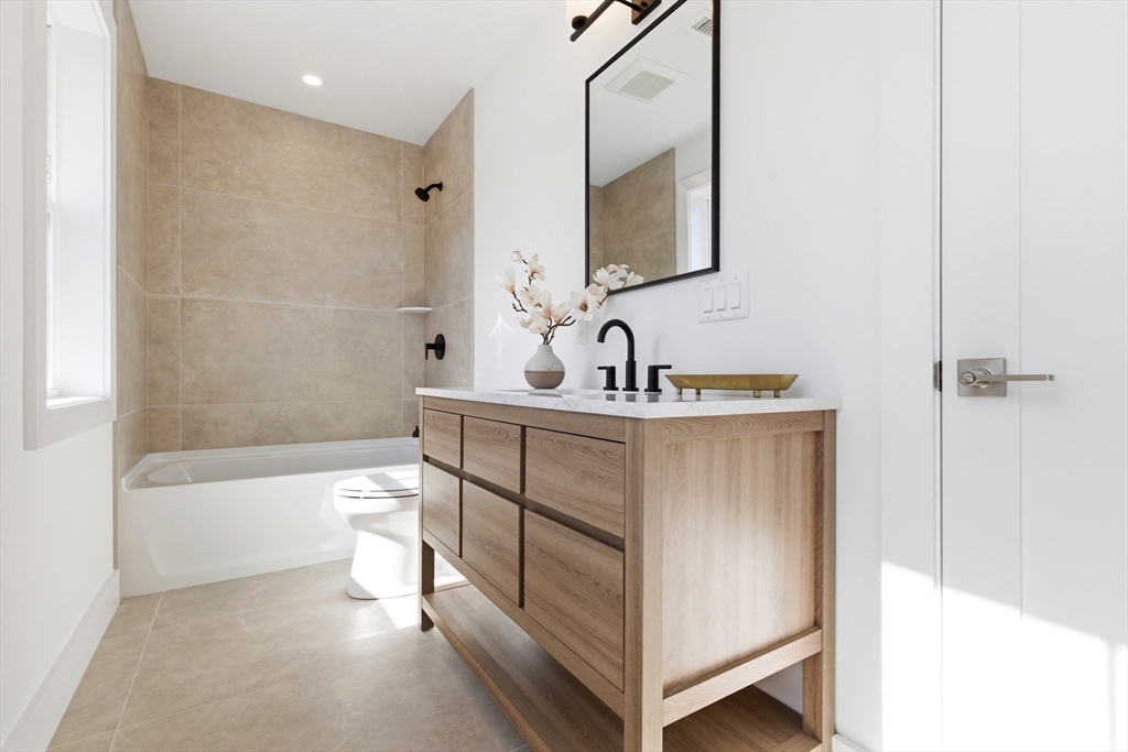 51 Fox Hill Road Nahant, MA 01908 - Photo 32 of 36 a bathroom with a sink a toilet and bathtub