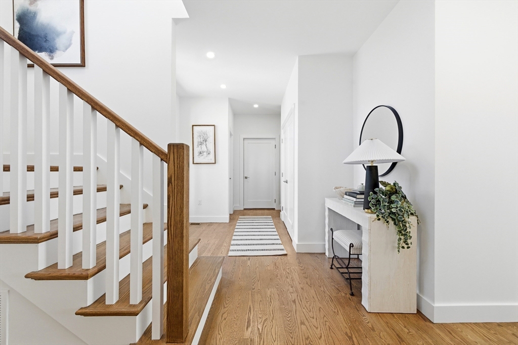 51 Fox Hill Road Nahant, MA 01908 - Photo 6 of 36 a view of a hallway with wooden floor and staircase