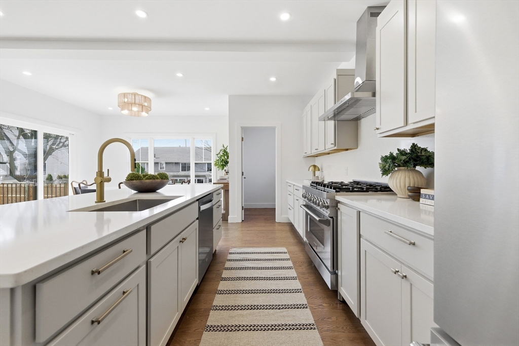 51 Fox Hill Road Nahant, MA 01908 - Photo 10 of 36 a kitchen with white cabinets and a stove