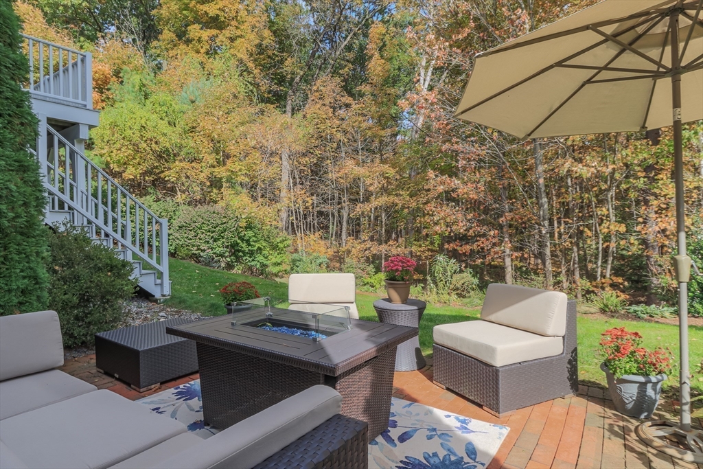 1 Integrity Way Groton, MA 01450 - Photo 30 of 36 a view of a patio with couches table and chairs and potted plants