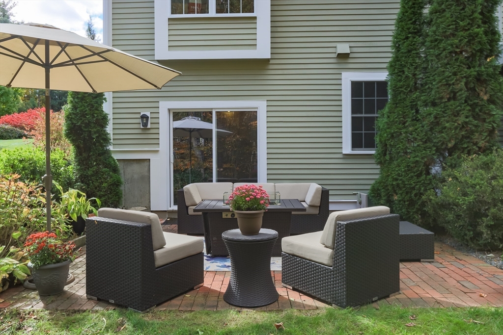 1 Integrity Way Groton, MA 01450 - Photo 31 of 36 a view of a patio with couches chairs and a potted plant