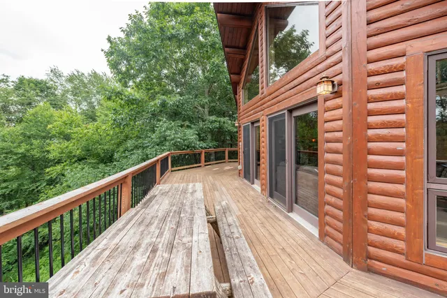 a bedroom with two beds and window
