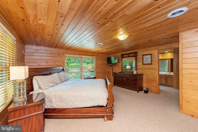 a room with pool table and a chandelier